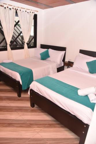 Ένα ή περισσότερα κρεβάτια σε δωμάτιο στο Hotel SAMAI