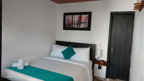 Ένα ή περισσότερα κρεβάτια σε δωμάτιο στο Hotel SAMAI