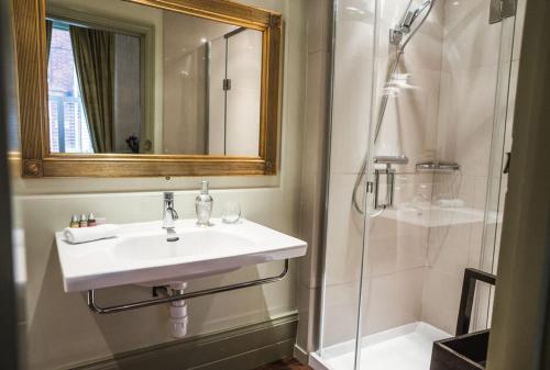 a bathroom with a sink and a shower at 38 St Giles in Norwich