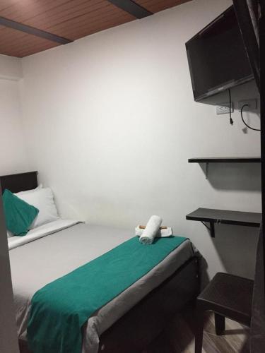 Ένα ή περισσότερα κρεβάτια σε δωμάτιο στο Hotel SAMAI