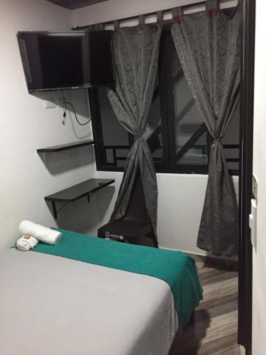 Ένα ή περισσότερα κρεβάτια σε δωμάτιο στο Hotel SAMAI