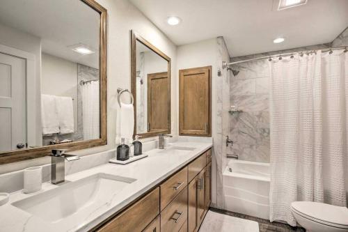 a bathroom with two sinks and a tub and a toilet at Modern Oregon Retreat w/ Deck, Hot Tub, Ocean View in Depoe Bay