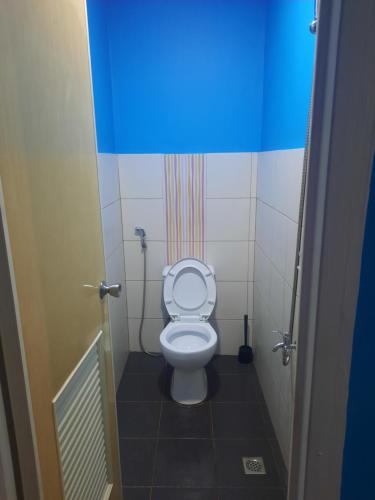 a bathroom with a toilet in a stall at bluenest apartment in Manila
