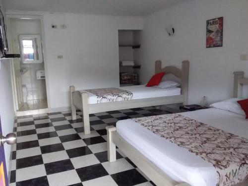 Postel nebo postele na pokoji v ubytování El Cortijo Hotel Campestre