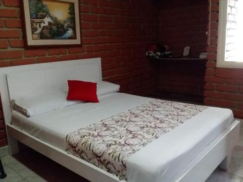 Postel nebo postele na pokoji v ubytování El Cortijo Hotel Campestre