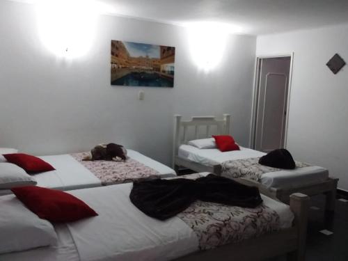 Postel nebo postele na pokoji v ubytování El Cortijo Hotel Campestre
