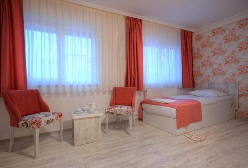 Postel nebo postele na pokoji v ubytování Hotel Abro Sezenler