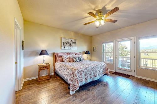 a bedroom with a bed and a ceiling fan at High Country Haven in Pagosa Springs