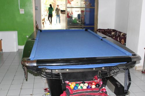 a pool table in a room with at OYO 985 The Twins Hostel in Bangkok