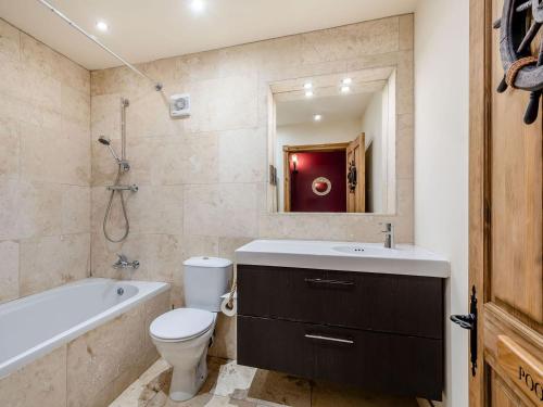 a bathroom with a toilet and a sink and a bath tub at Seaviews And Hot Tub At Admirals Anchor in Portpatrick