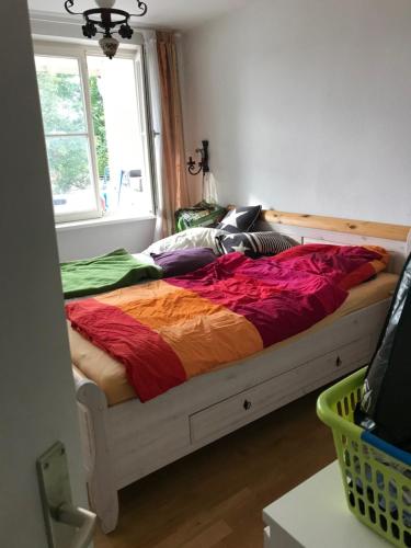 a bed sitting in a bedroom with a window at Private Apartment & Hannover City Altstadt in Hannover