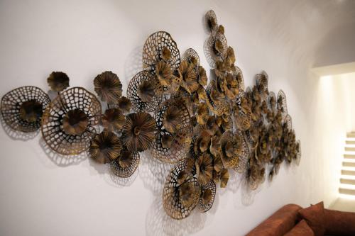 a group of butterflies hanging on a wall at Elisabeth Boutique Hotel in Thessaloniki