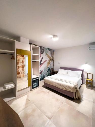 a bedroom with a large bed in a room at Olea Relais in Conversano