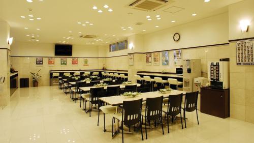 a large dining room with tables and chairs at Toyoko Inn Kyoto Gojo omiya in Kyoto
