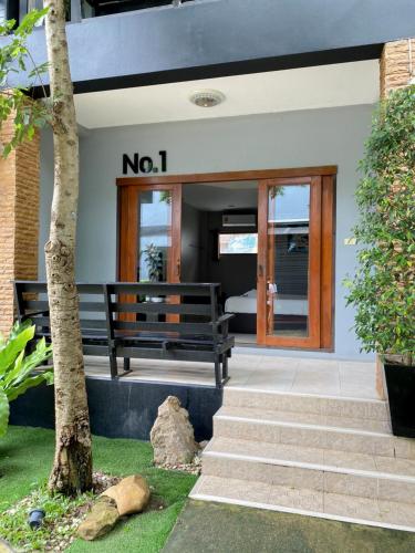 a no sign on a house with a bench at Natthapon Resort Kaeng Kachan in Kaeng Krachan