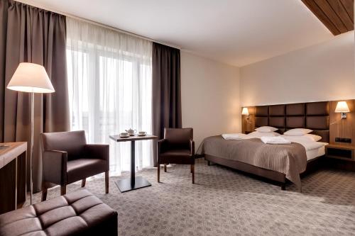 Una cama o camas en una habitación de Osada Śnieżka koło Karpacza