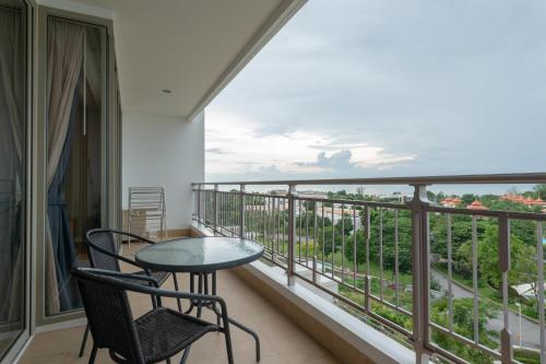 a balcony with a table and chairs and a view at Deluxe 1bedroom Hua Hin Seaview Beachfront Project in Ban Bo Fai
