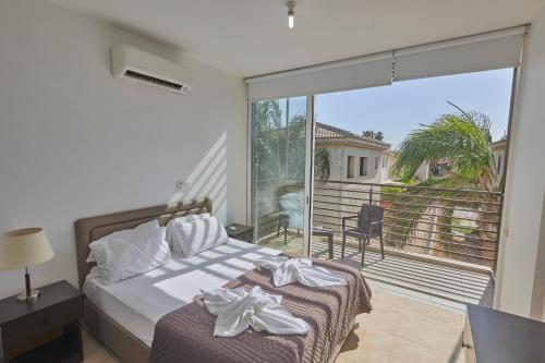 Llit o llits en una habitació de Pearl Villas