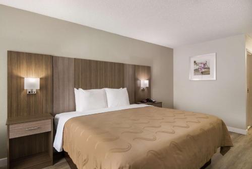 a hotel room with a large bed in a room at Quality Inn in Emporia