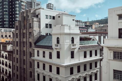 a white building in a city with tall buildings at Gorgeous George by Design Hotels ™ in Cape Town
