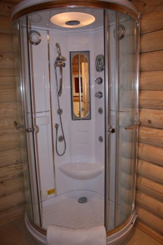 a bathroom with a shower and a sink at BCC Loch Ness Log Cabins in Bearnock