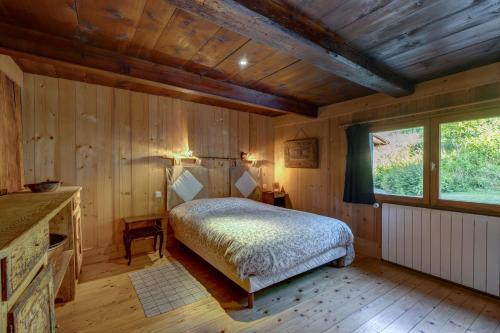 เตียงในห้องที่ Chalet Panoramique