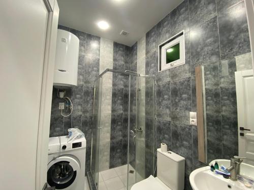 a bathroom with a shower and a toilet and a sink at Villa Maria Dilijan in Dilijan