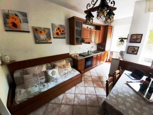 a kitchen with a table and a counter top at Casa Lù in Abbadia Lariana