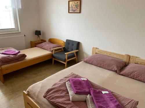 Postel nebo postele na pokoji v ubytování Rybářská restaurace a penzion u Horáků