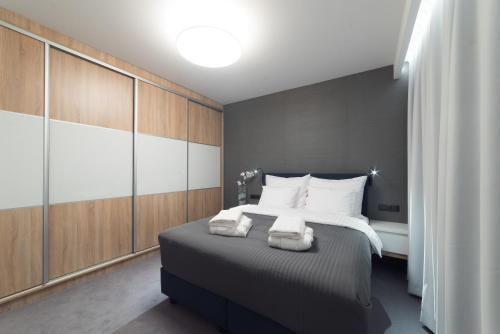 Ένα ή περισσότερα κρεβάτια σε δωμάτιο στο Apart-Hotel VIVI RESIDENCE & SPA