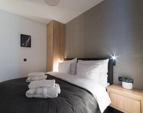 Ένα ή περισσότερα κρεβάτια σε δωμάτιο στο Apart-Hotel VIVI RESIDENCE & SPA