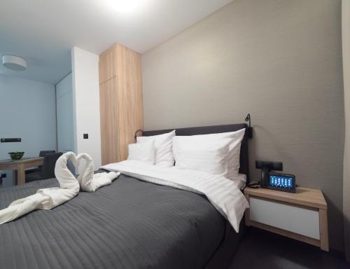 Ένα ή περισσότερα κρεβάτια σε δωμάτιο στο Apart-Hotel VIVI RESIDENCE & SPA