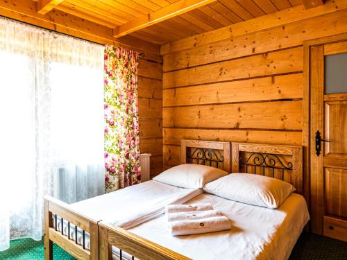 Giường trong phòng chung tại Willa Podhalanka, Dom dla max 20 osób na wyłączność