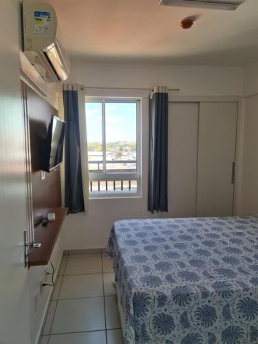 Flat Smart Residenceにあるベッド