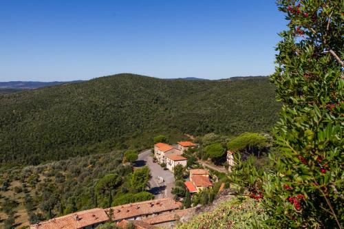 a house in the middle of a mountain at Amazing Tuscany Window in Montemassi