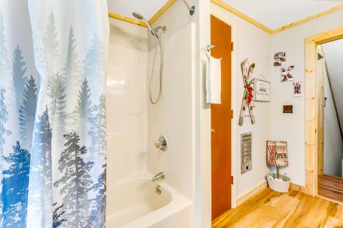 a bathroom with a shower and a shower curtain at Grandfather's Gem Getaway in Banner Elk