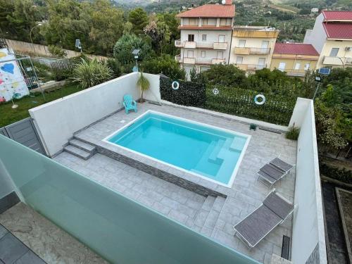 a swimming pool on top of a building at Blu loft in Salemi