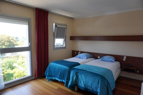 Postel nebo postele na pokoji v ubytování Hotel Ker Vennaik