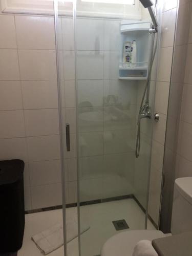 a bathroom with a glass shower with a toilet at TESTEINA PLAYA SAN AGUSTIN in Maspalomas