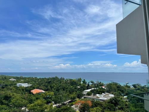 a view of the ocean from a building at ReLuxe マリン Condo in Maribago