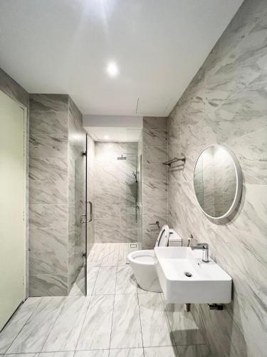 a bathroom with a sink and a mirror at Imperio Residences Private Bathtub or Jacuzzi by Nestcove in Melaka