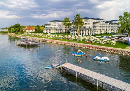 a group of people in the water at a resort at BalaLake Resort in Szántód