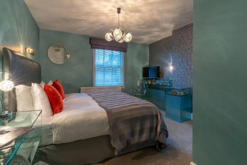 a bedroom with a bed and a glass table at Blanch House in Brighton & Hove