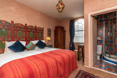 a bedroom with a large bed and a window at Blanch House in Brighton & Hove