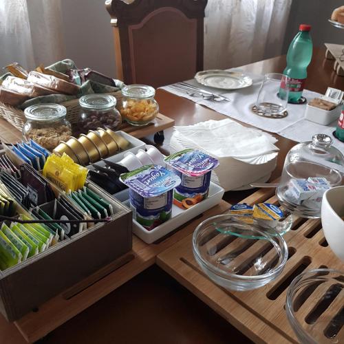 a wooden table with food on top of it at B & B Cedro Argentato in Legnago