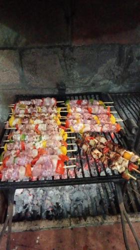 a bunch of meat and vegetables on a grill at FONDAZIONE VILLA POINT ONLUS in San Felice Circeo