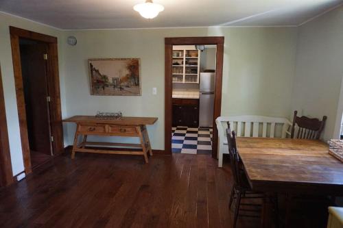 a living room with a wooden table and a dining room at 3778 East Lake Road in Dunkirk