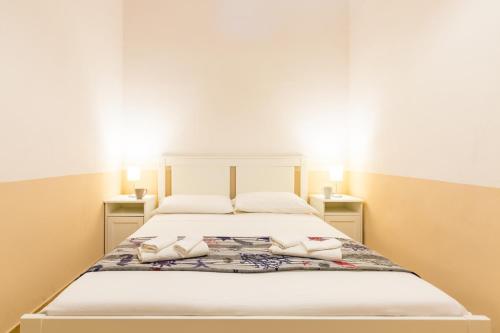 Postel nebo postele na pokoji v ubytování La Marina