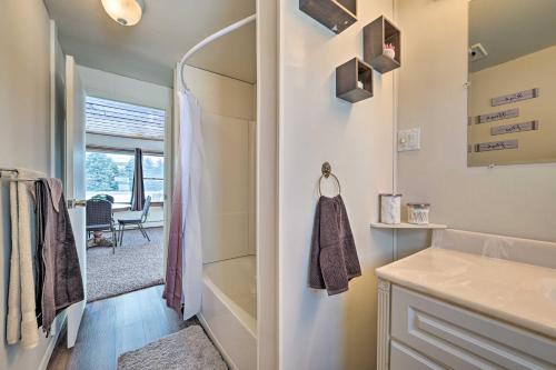 a bathroom with a shower and a sink at Cozy Tawas City Home with Views of Lake Huron! in Tawas City