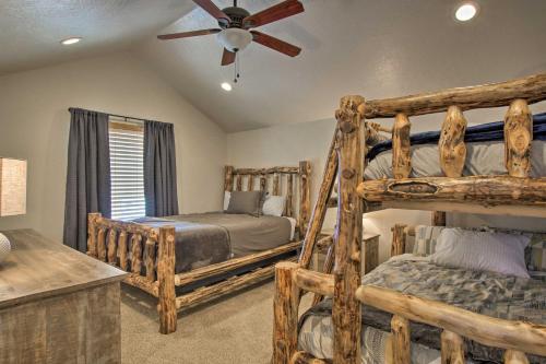 a bedroom with two bunk beds and a ceiling fan at 2-Condo Property with Mtn Views by Golf and Ski Resort in Eden